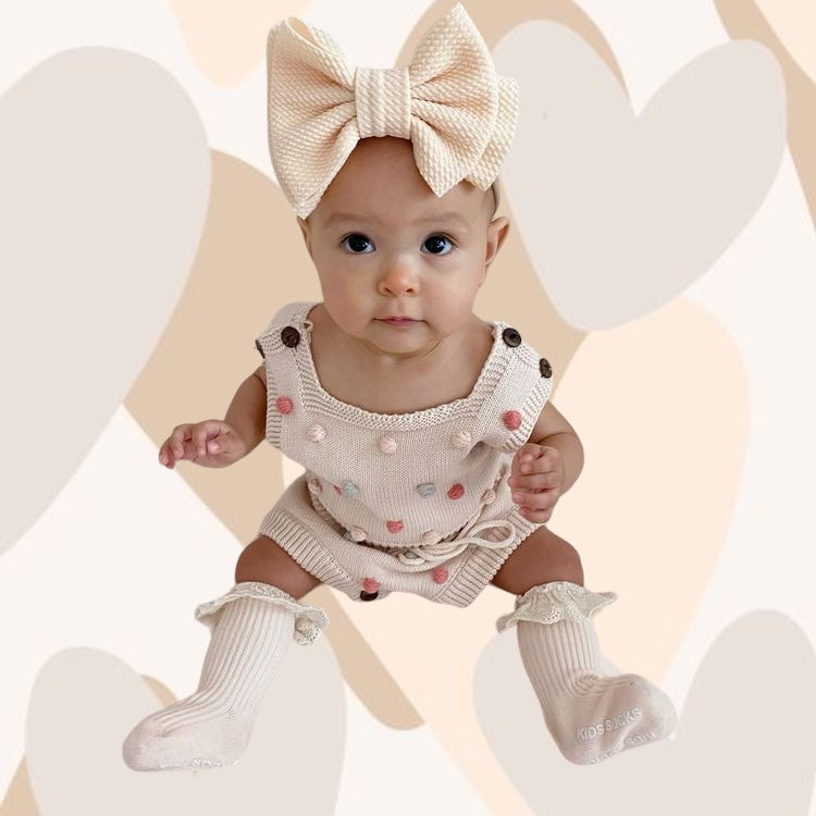 Baby girls knitted jumpsuit with pompoms